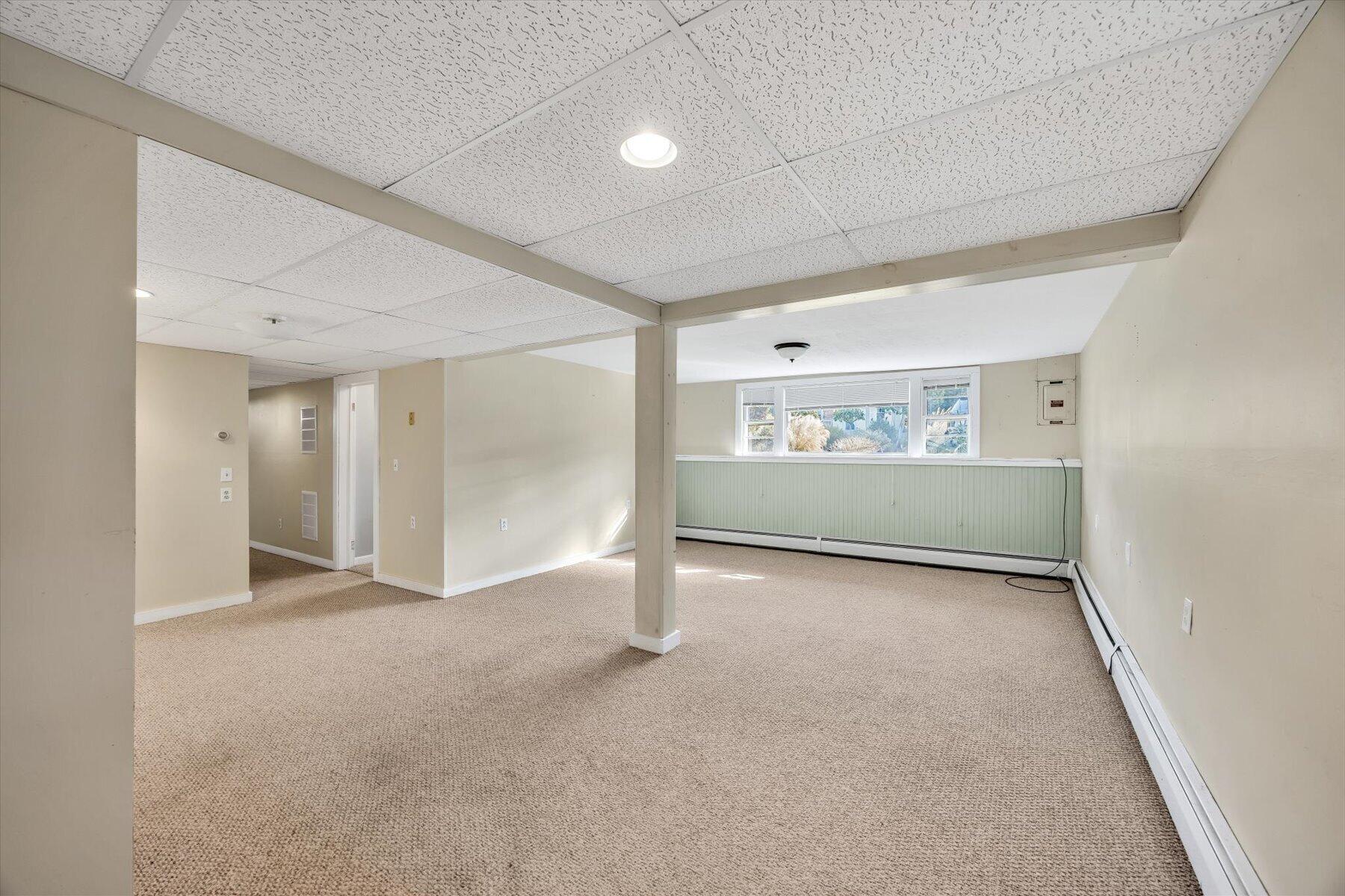 27 Madeline Road East Falmouth, MA 02536 - Photo 28 of 43 an empty room with a empty space and windows