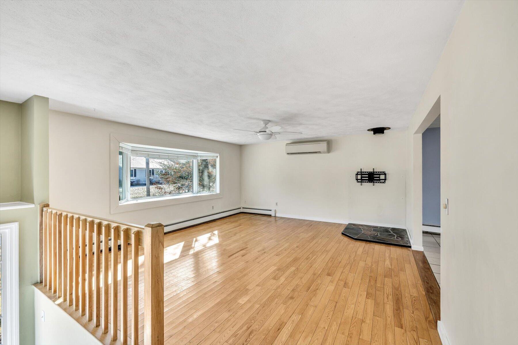 27 Madeline Road East Falmouth, MA 02536 - Photo 8 of 43 a view of a hallway with wooden floor and front door