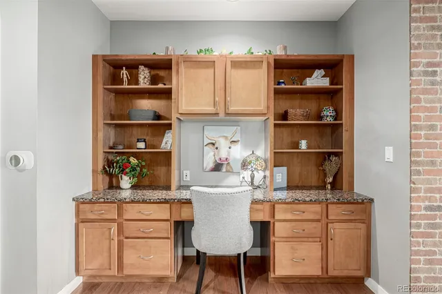 a room with a cabinets and book shelf