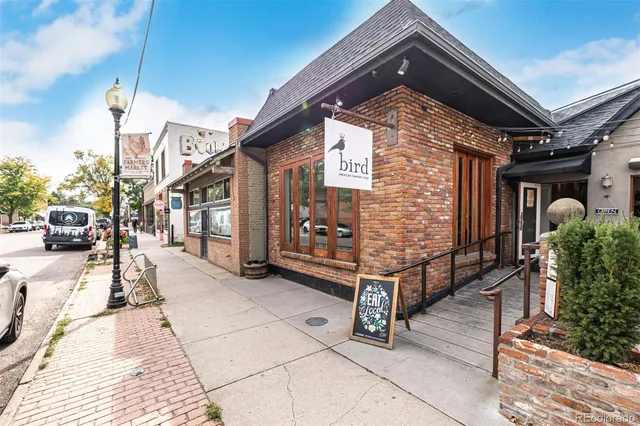 a front view of a house with a large windows