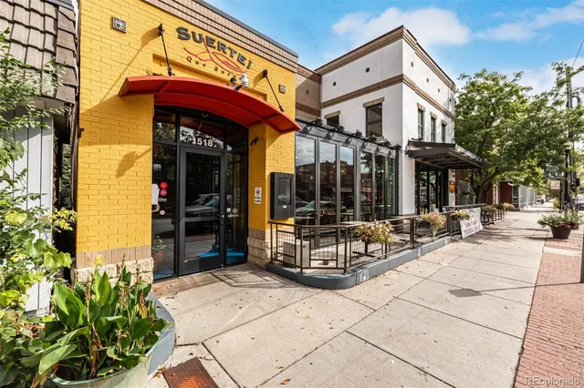 a view of a building with sitting area