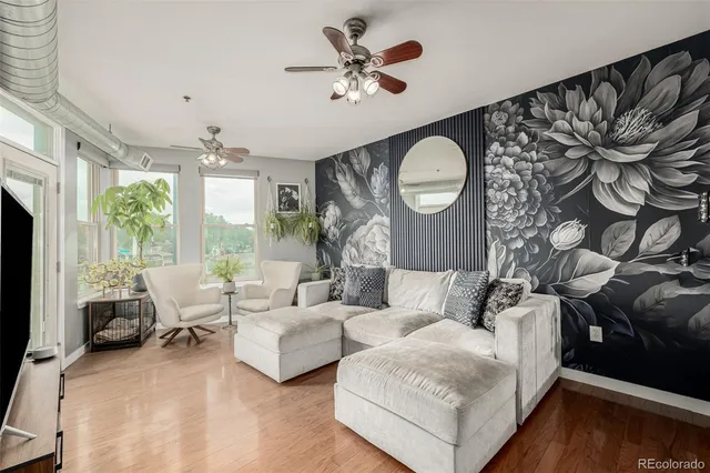 a living room with furniture and a large window