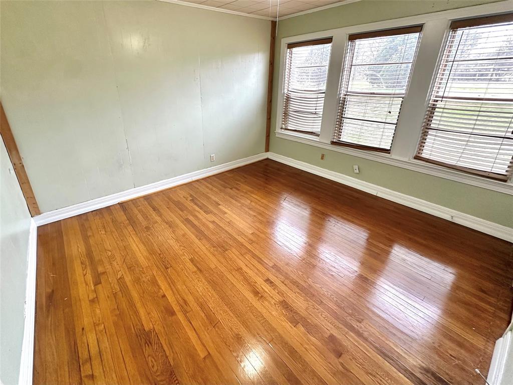 1694 Old Luling Road Lockhart, TX 78644 - Photo 8 of 20 Large bedroom with wood floors and ample windows for natural light