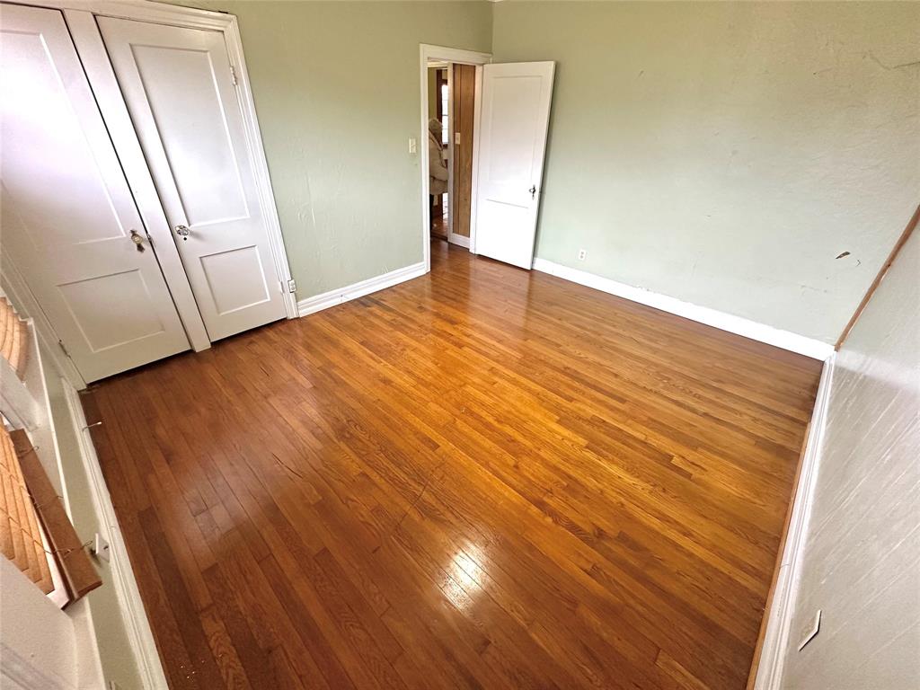1694 Old Luling Road Lockhart, TX 78644 - Photo 9 of 20 guest bedroom with wood floors
