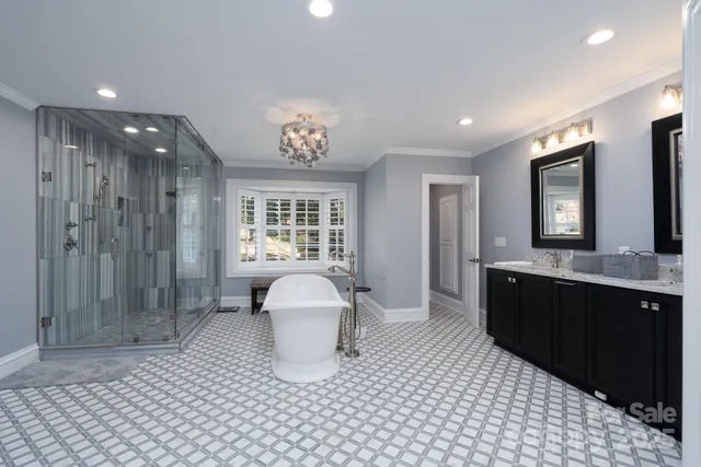 a large bathroom with a sink a toilet and shower