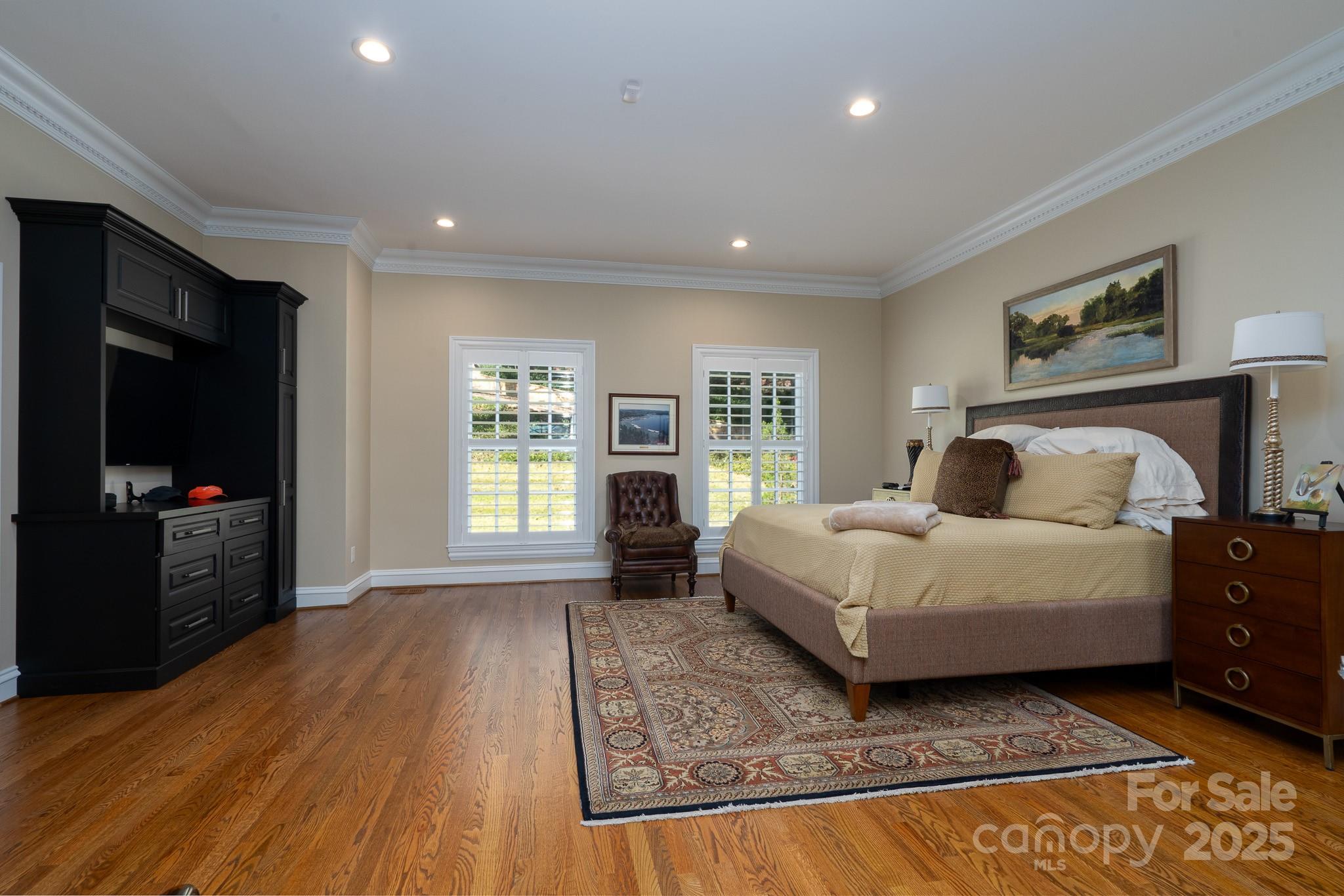 444 Glenbrook Spring New London, NC 28127 - Photo 34 of 48 a bedroom with a bed and wooden floor