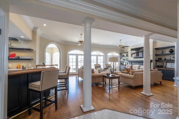 a view of a dining room with furniture window and wooden floor