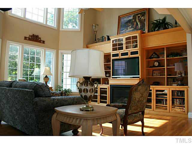 1421 Lakewind Court Raleigh, NC 27603 - Photo 6 of 24 Gorgeous two story living room ! Beautiful architecture with deep crown moldings and base boards thru-out the house. All interior doors are taller then standard. Living Room