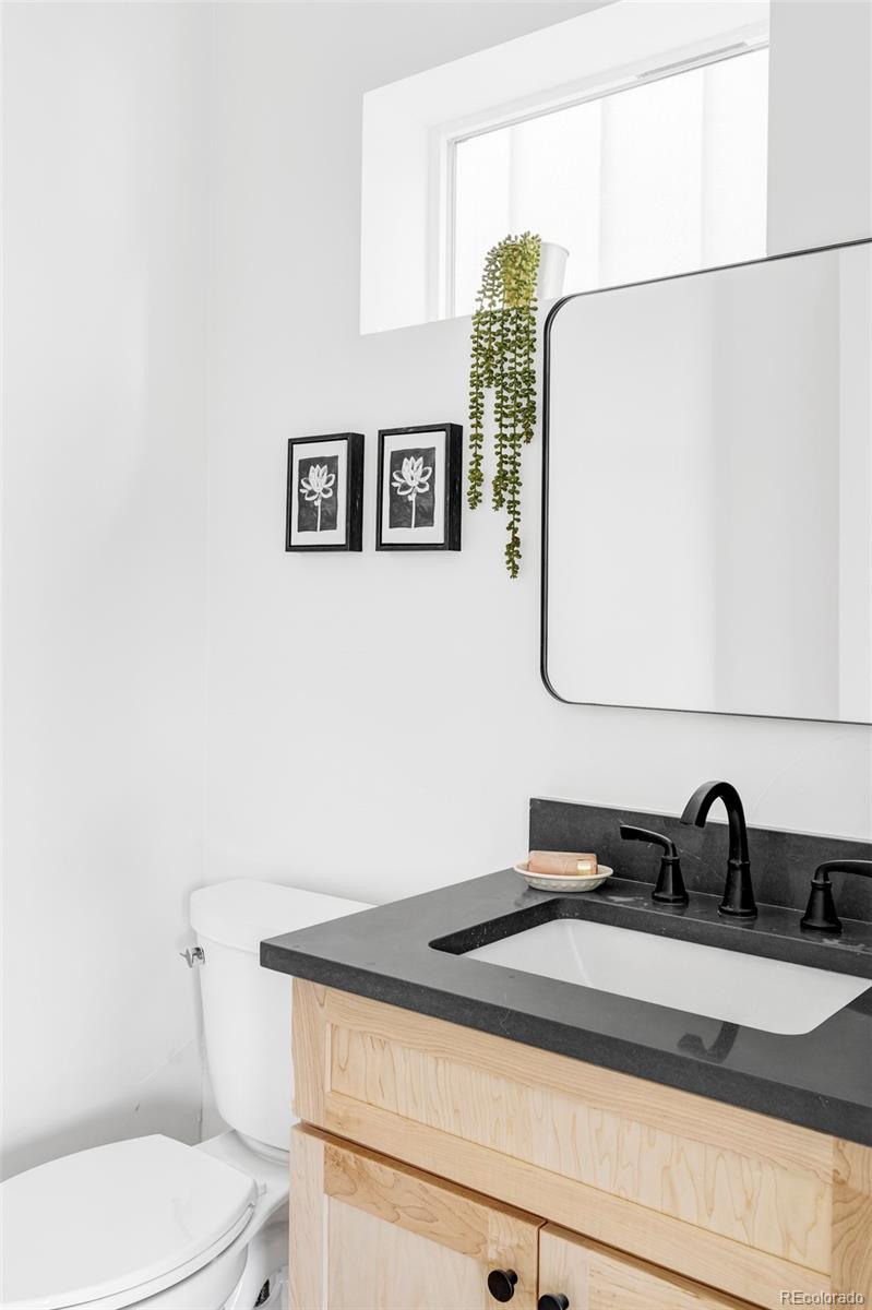 2914 Hooker Street Denver, CO 80211 - Photo 13 of 30 a bathroom with a sink and a toilet