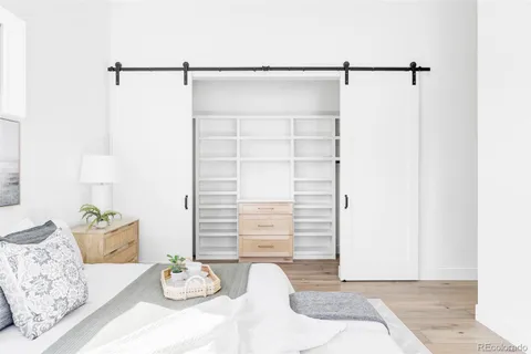 a bedroom with a bed and a dresser