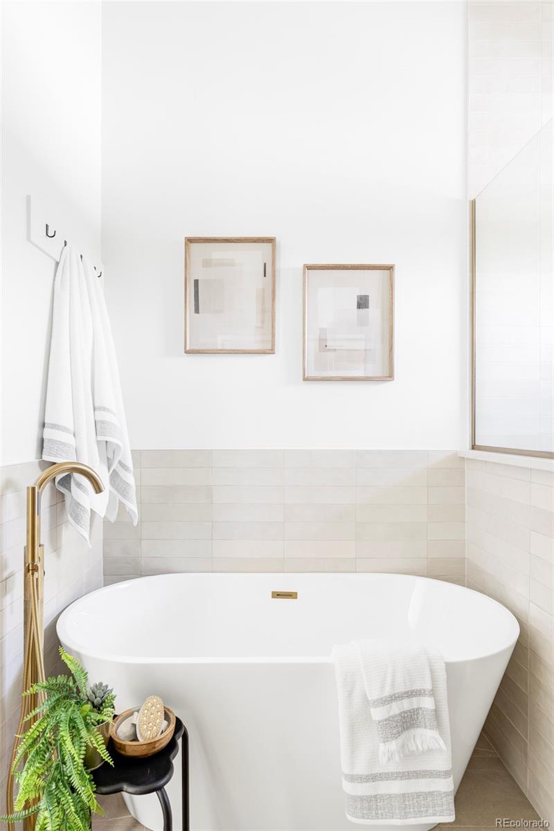 2914 Hooker Street Denver, CO 80211 - Photo 18 of 30 a bathroom with a tub and a shower