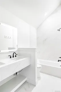 a bathroom with a sink and a bathtub