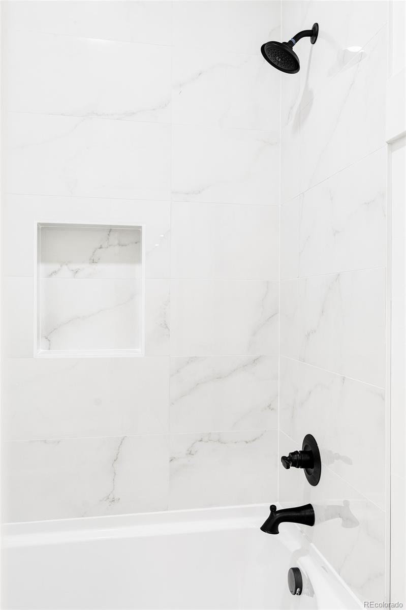 2914 Hooker Street Denver, CO 80211 - Photo 27 of 30 a bathroom with a bathtub