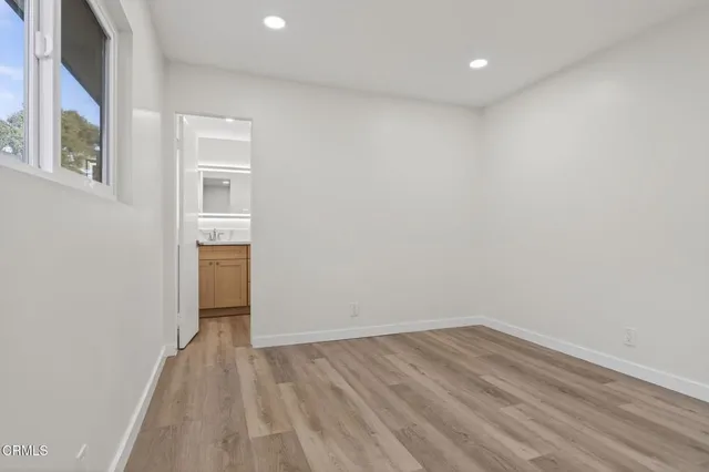 a bathroom with a sink toilet a mirror and shower