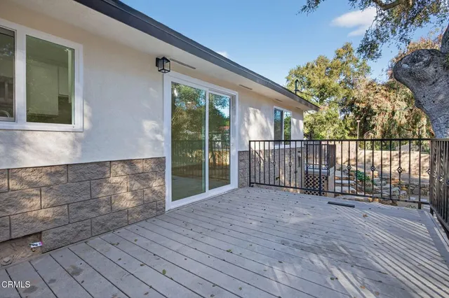 a view of a porch with a tree