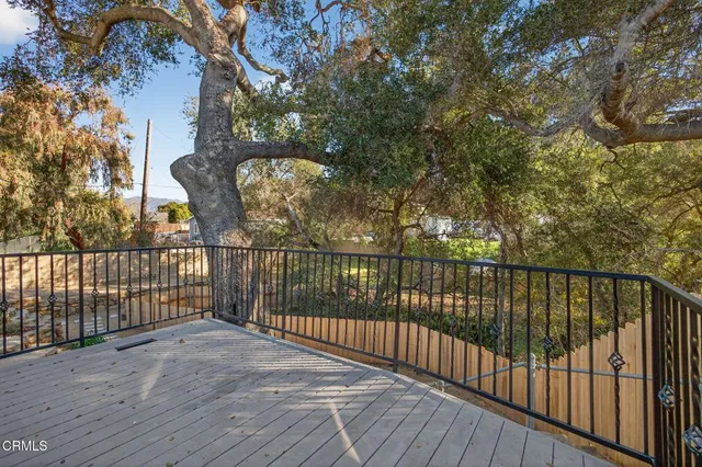a view of balcony with wooden floor