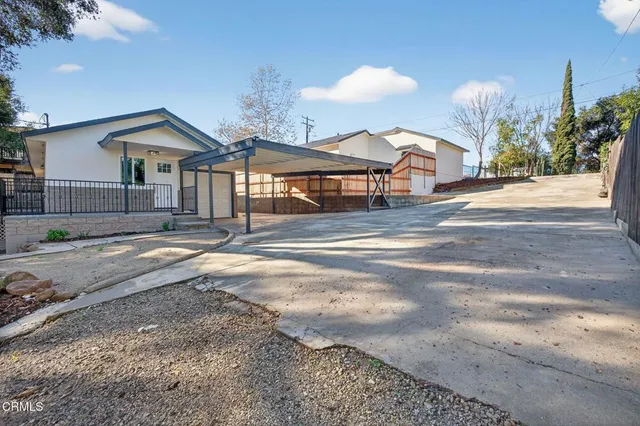a view of a bench in a backyard