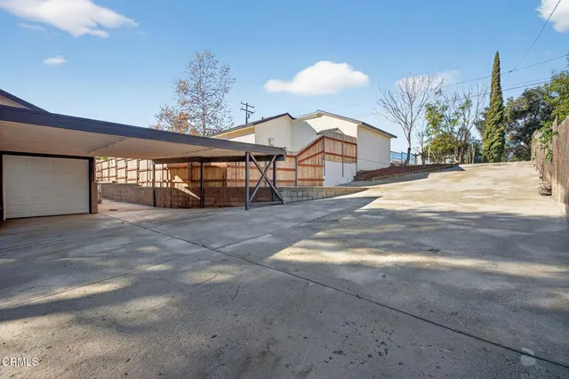 a view of a backyard of the house