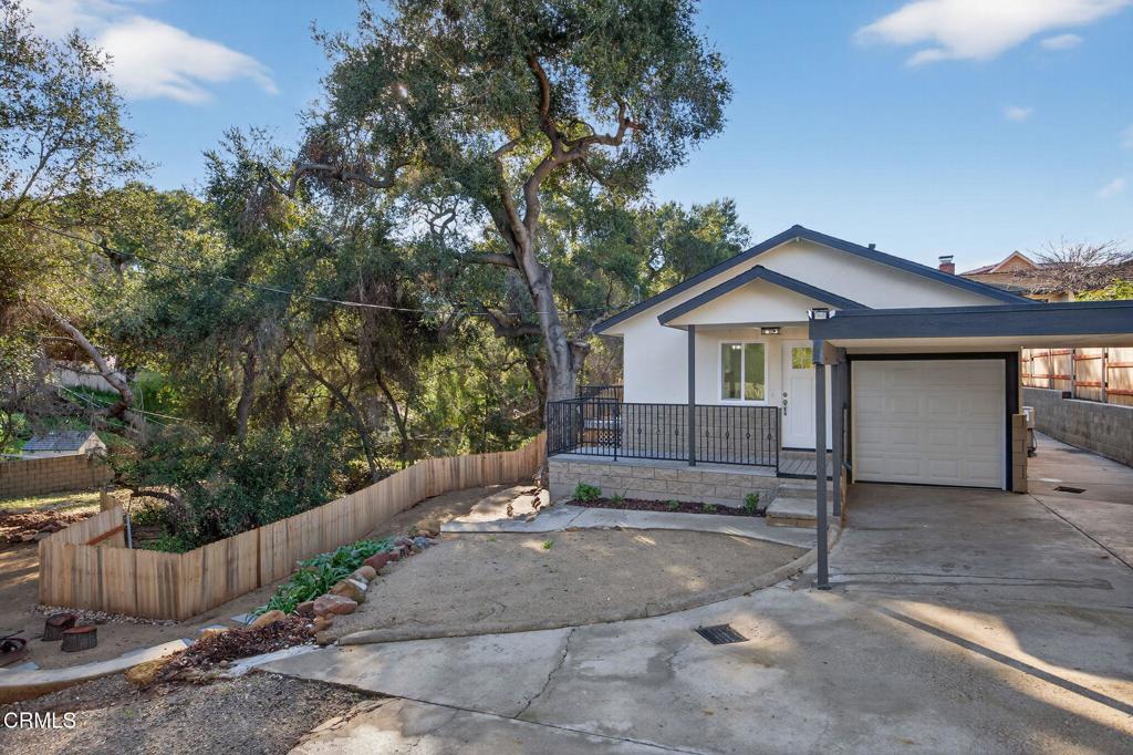 312 Prospect Street Oak View, CA 93022 - Photo 4 of 45 a view of a house with a yard and large tree