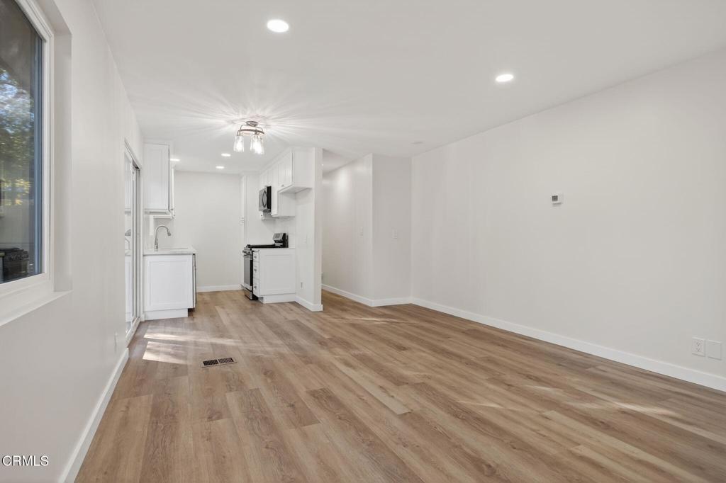 312 Prospect Street Oak View, CA 93022 - Photo 8 of 45 a view of empty room with wooden floor