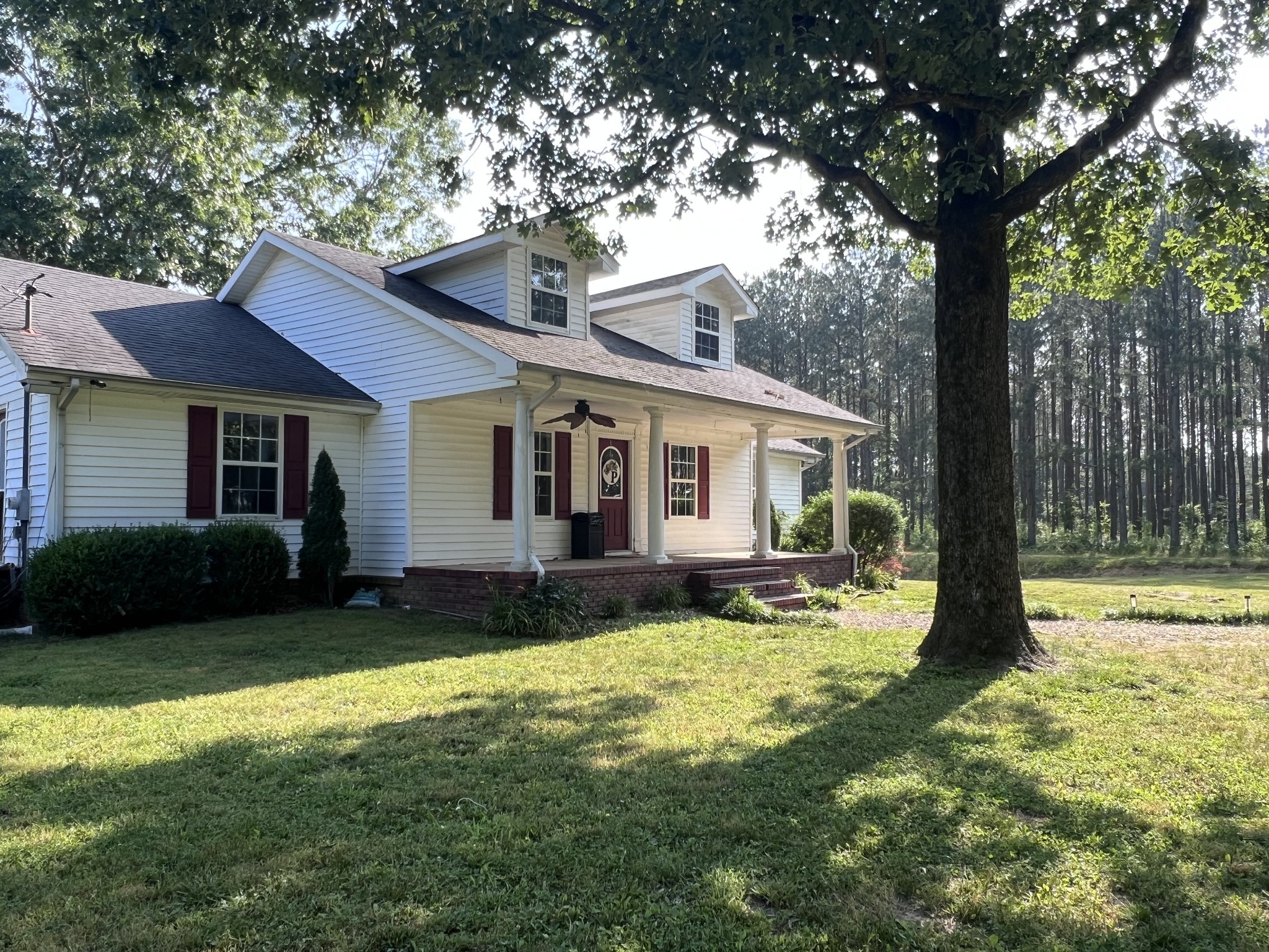 86 Yoder Road Ethridge, TN 38456 - Photo 1 of 3 a view of a house with a yard and large tree