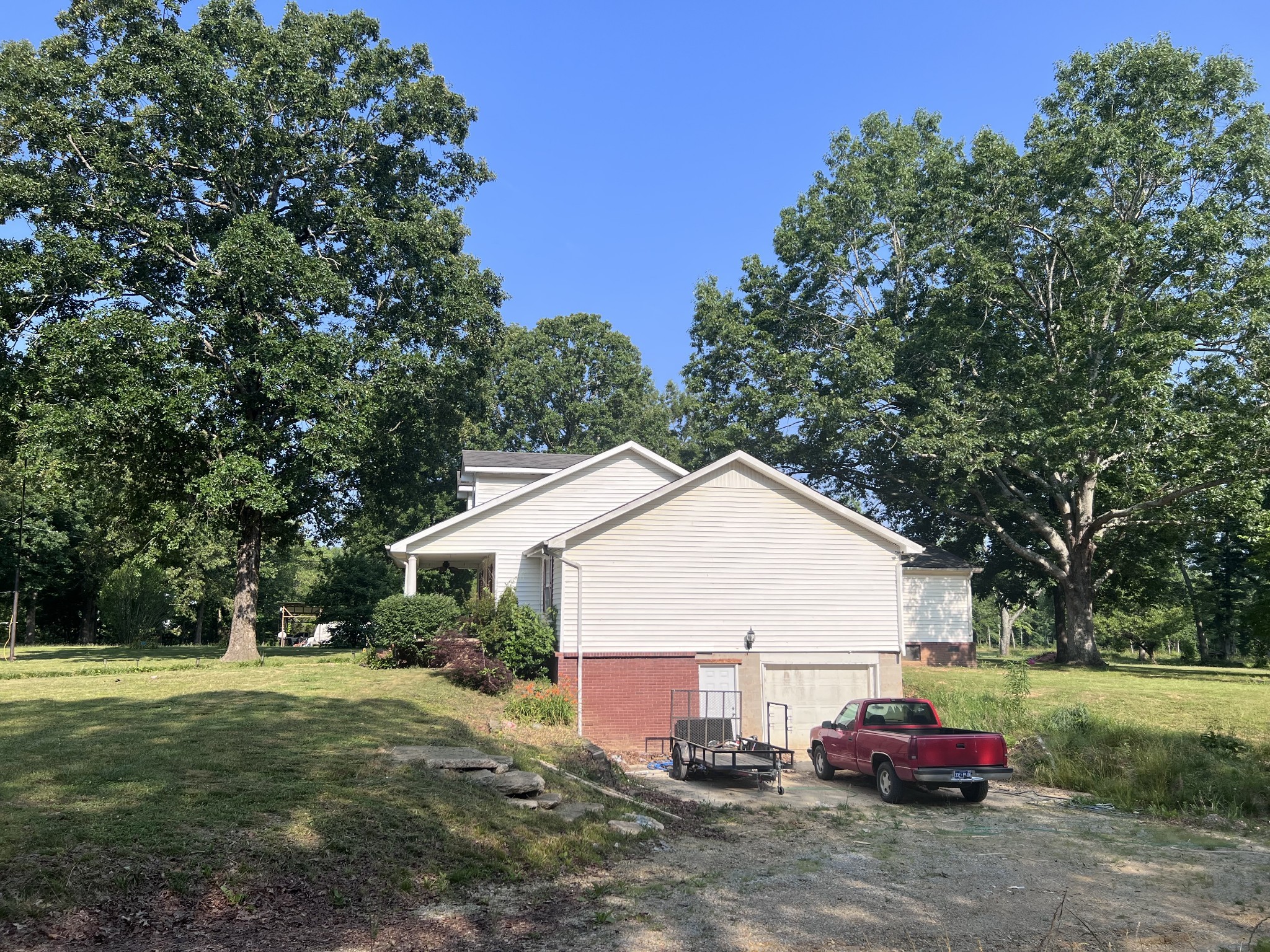 86 Yoder Road Ethridge, TN 38456 - Photo 2 of 3 a view of a house with a yard