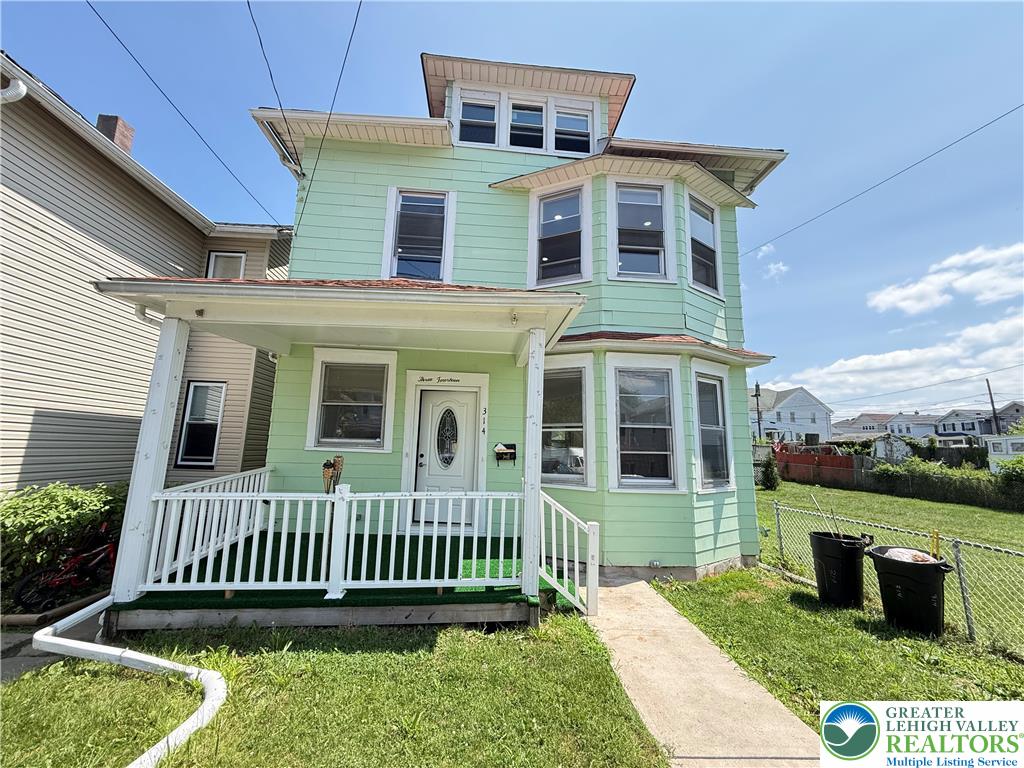 314 North Garfield Avenue Scranton, PA 18504 - Photo 1 of 21 A charming three-story home with a welcoming front porch and a neatly fenced yard.