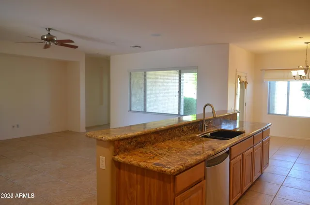a kitchen with a stove and a sink