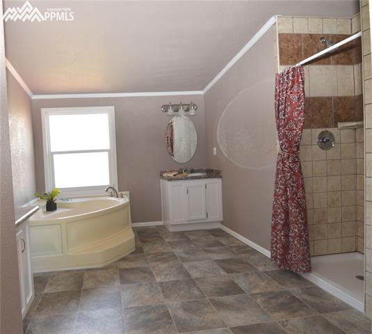27055 Handle Road Calhan, CO 80808 - Photo 12 of 25 The master bathroom with a garden tub and 2 vanities.