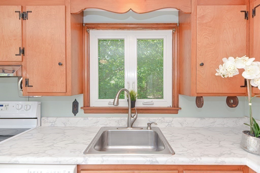 157 Vincent Road Dedham, MA 02026 - Photo 11 of 38 a kitchen with a sink and a window