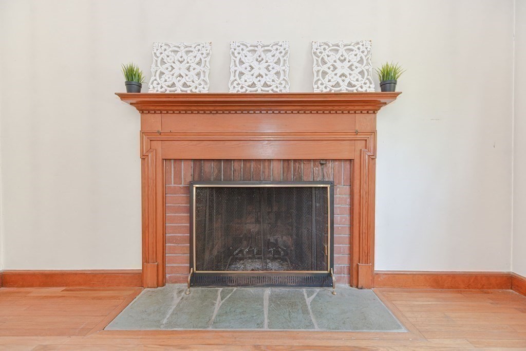 157 Vincent Road Dedham, MA 02026 - Photo 17 of 38 a close view of a fireplace in an empty room
