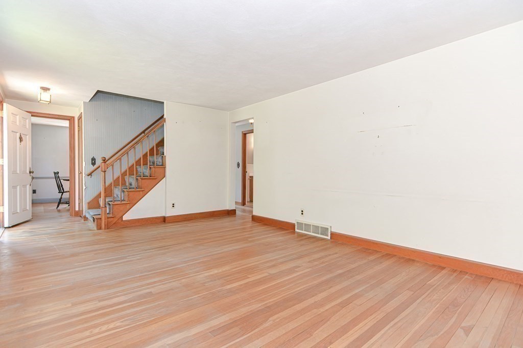 157 Vincent Road Dedham, MA 02026 - Photo 19 of 38 a view of an empty room with wooden floor