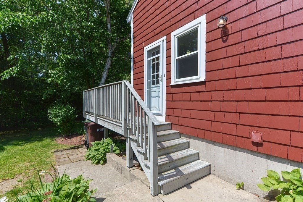 157 Vincent Road Dedham, MA 02026 - Photo 2 of 38 a view of a pathway with a house in the background