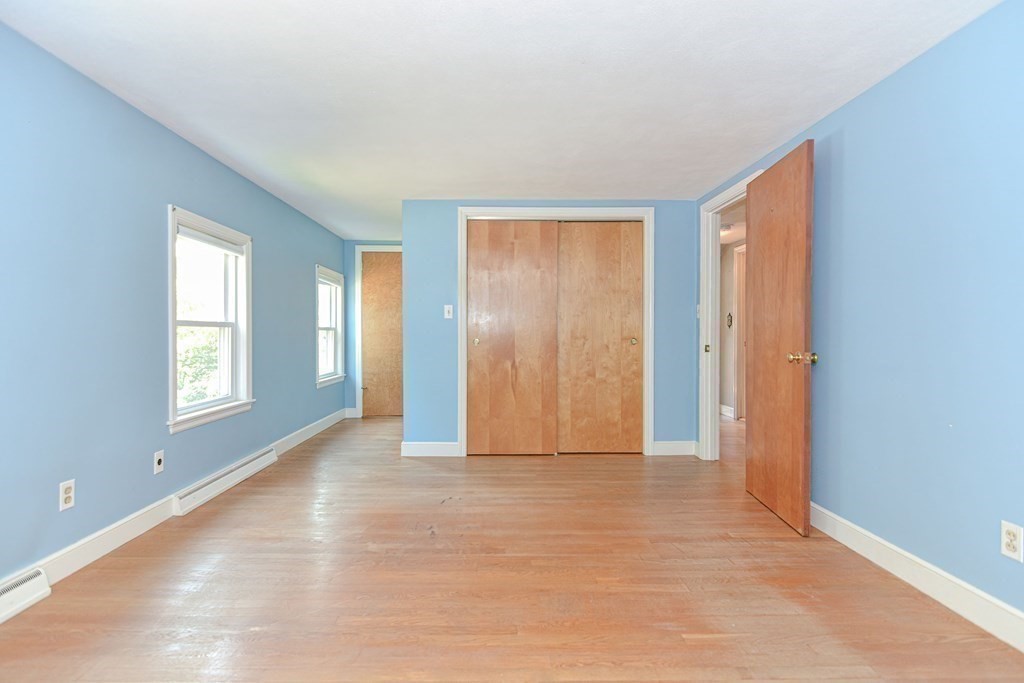 157 Vincent Road Dedham, MA 02026 - Photo 23 of 38 a view of an empty room with window and closet area
