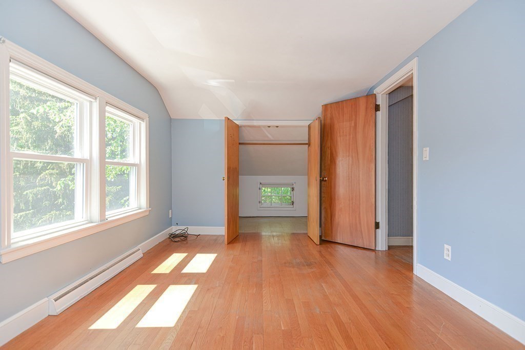 157 Vincent Road Dedham, MA 02026 - Photo 27 of 38 an empty room with wooden floor and windows