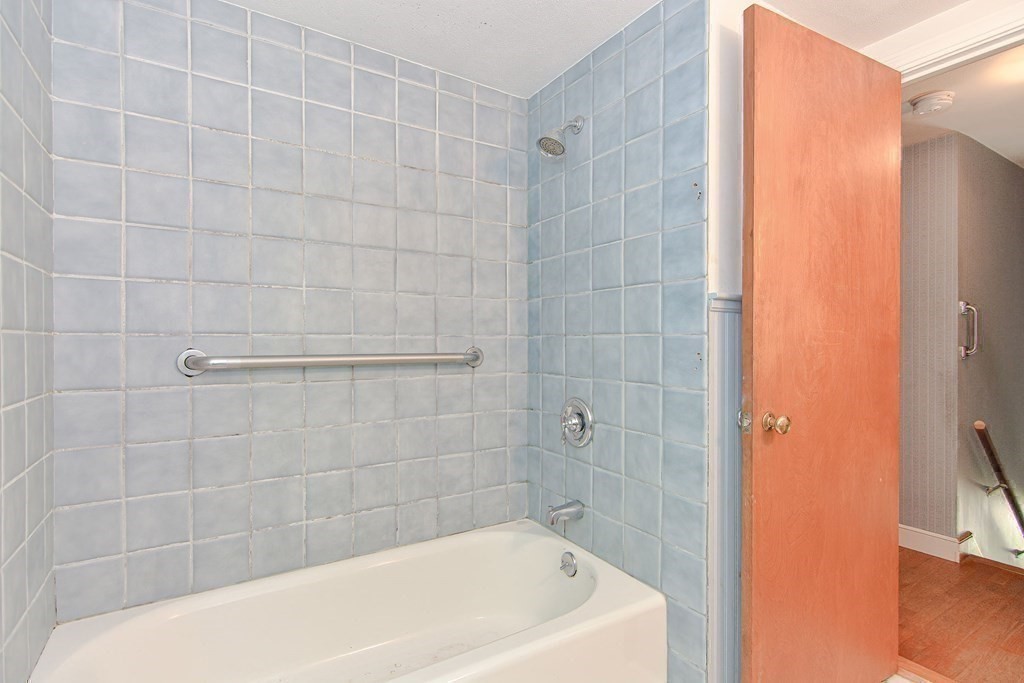 157 Vincent Road Dedham, MA 02026 - Photo 31 of 38 a bathroom with a bathtub