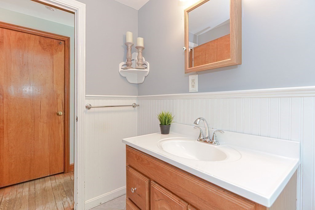 157 Vincent Road Dedham, MA 02026 - Photo 33 of 38 a bathroom with a sink and a mirror