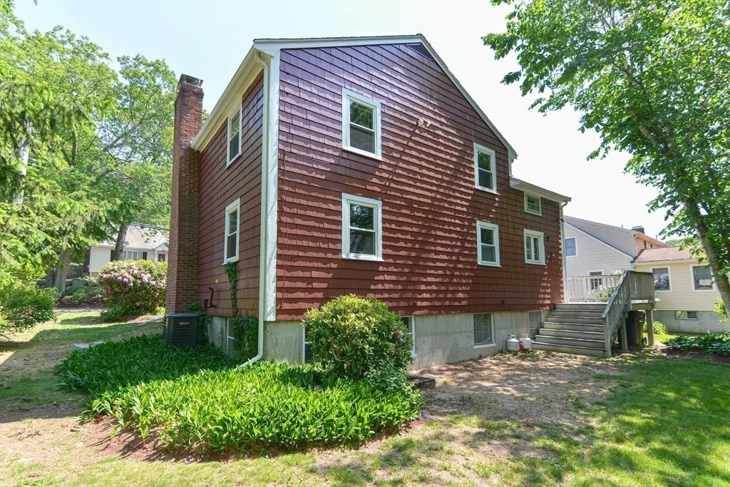 157 Vincent Road Dedham, MA 02026 - Photo 4 of 38 a front view of a house with a garden