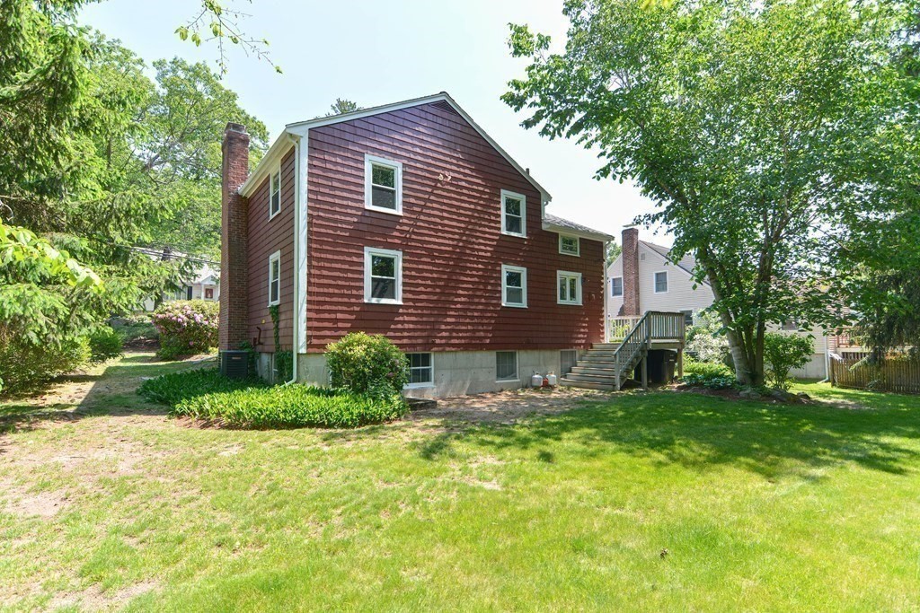 157 Vincent Road Dedham, MA 02026 - Photo 6 of 38 a brick house with a yard plants and big trees