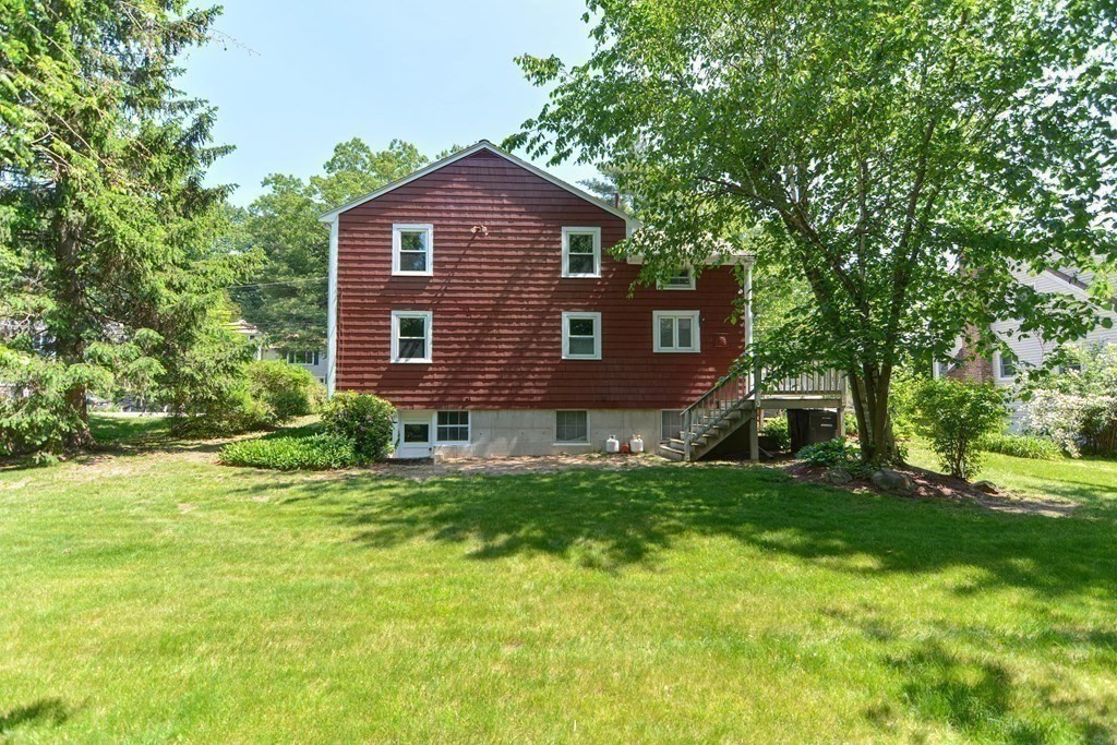 157 Vincent Road Dedham, MA 02026 - Photo 7 of 38 a view of a house with a yard