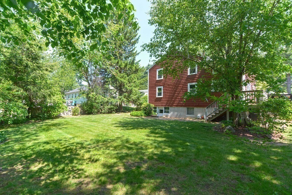 157 Vincent Road Dedham, MA 02026 - Photo 9 of 38 a view of a big yard with large trees