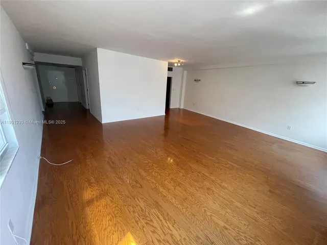 a view of a big room with closet and mirror