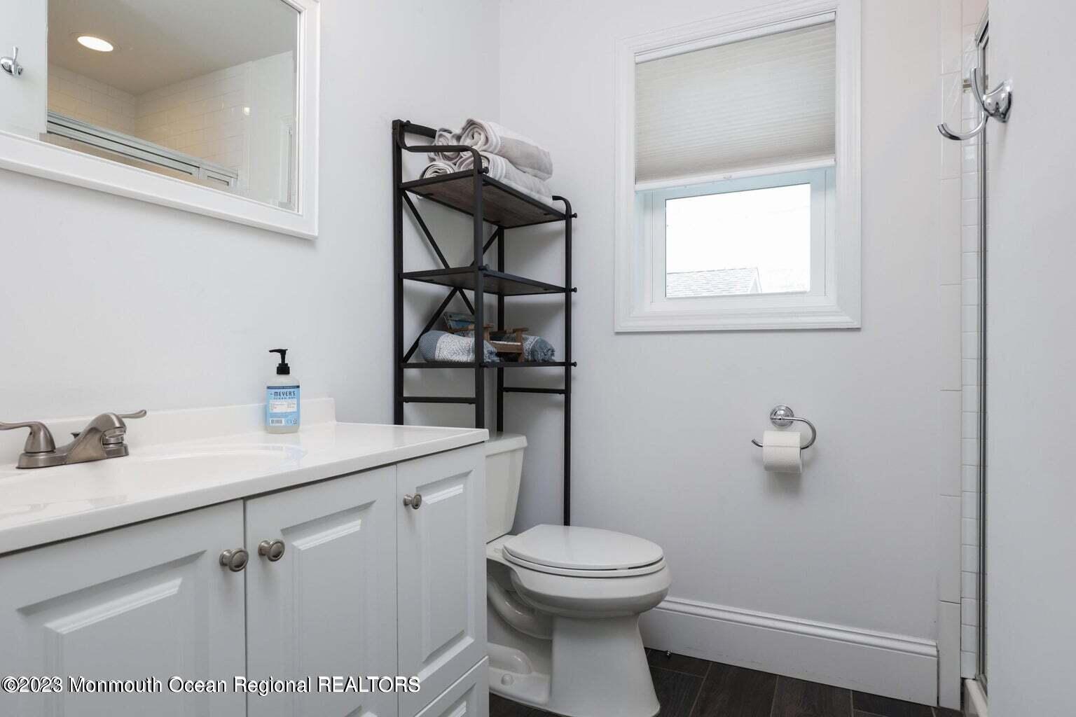 118 West Tide Way Lavallette, NJ 08735 - Photo 11 of 14 a bathroom with a toilet sink and mirror