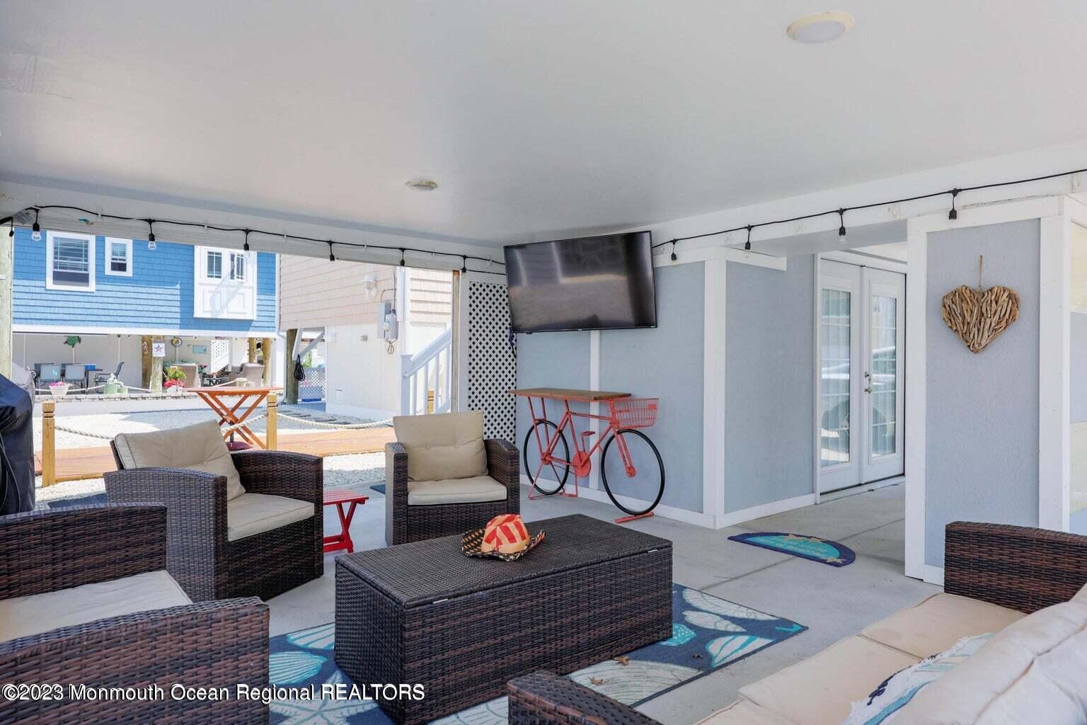 118 West Tide Way Lavallette, NJ 08735 - Photo 13 of 14 a living room with furniture and a window