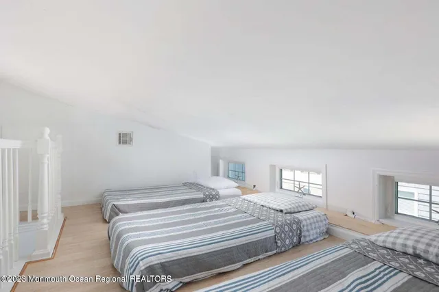 a bedroom with a bed window and a bed