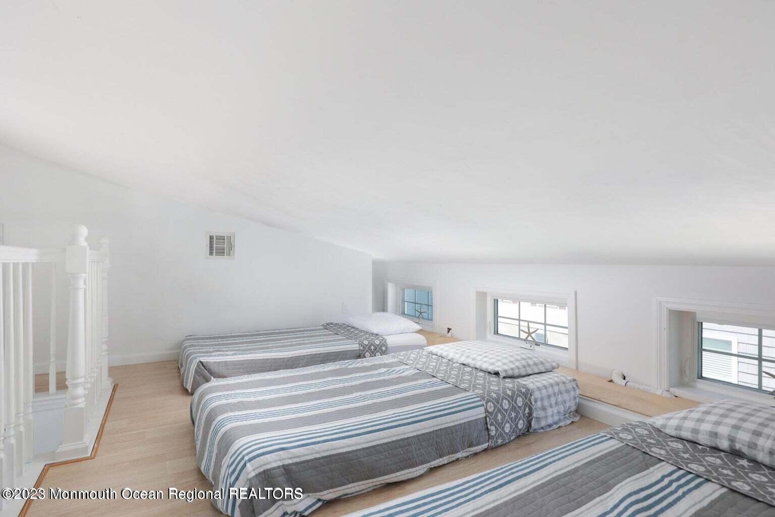 118 West Tide Way Lavallette, NJ 08735 - Photo 8 of 14 a bedroom with a bed and a window