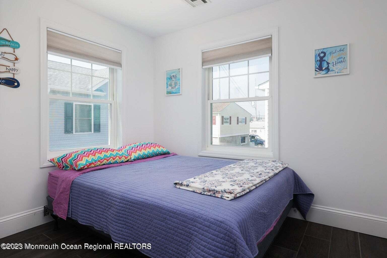 118 West Tide Way Lavallette, NJ 08735 - Photo 10 of 14 a bedroom with a bed and a window