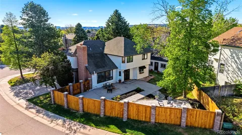 an aerial view of a house with a yard basket ball court and outdoor seating