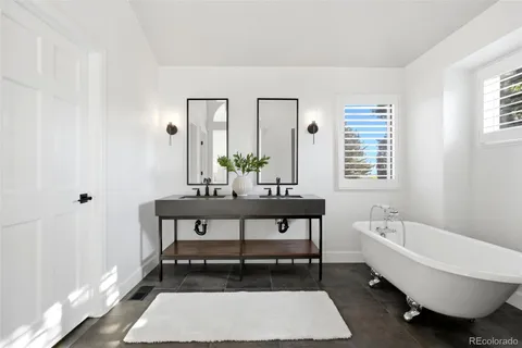 a living room with a rug and a window