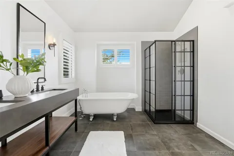 a bathroom with a sink a toilet and tub